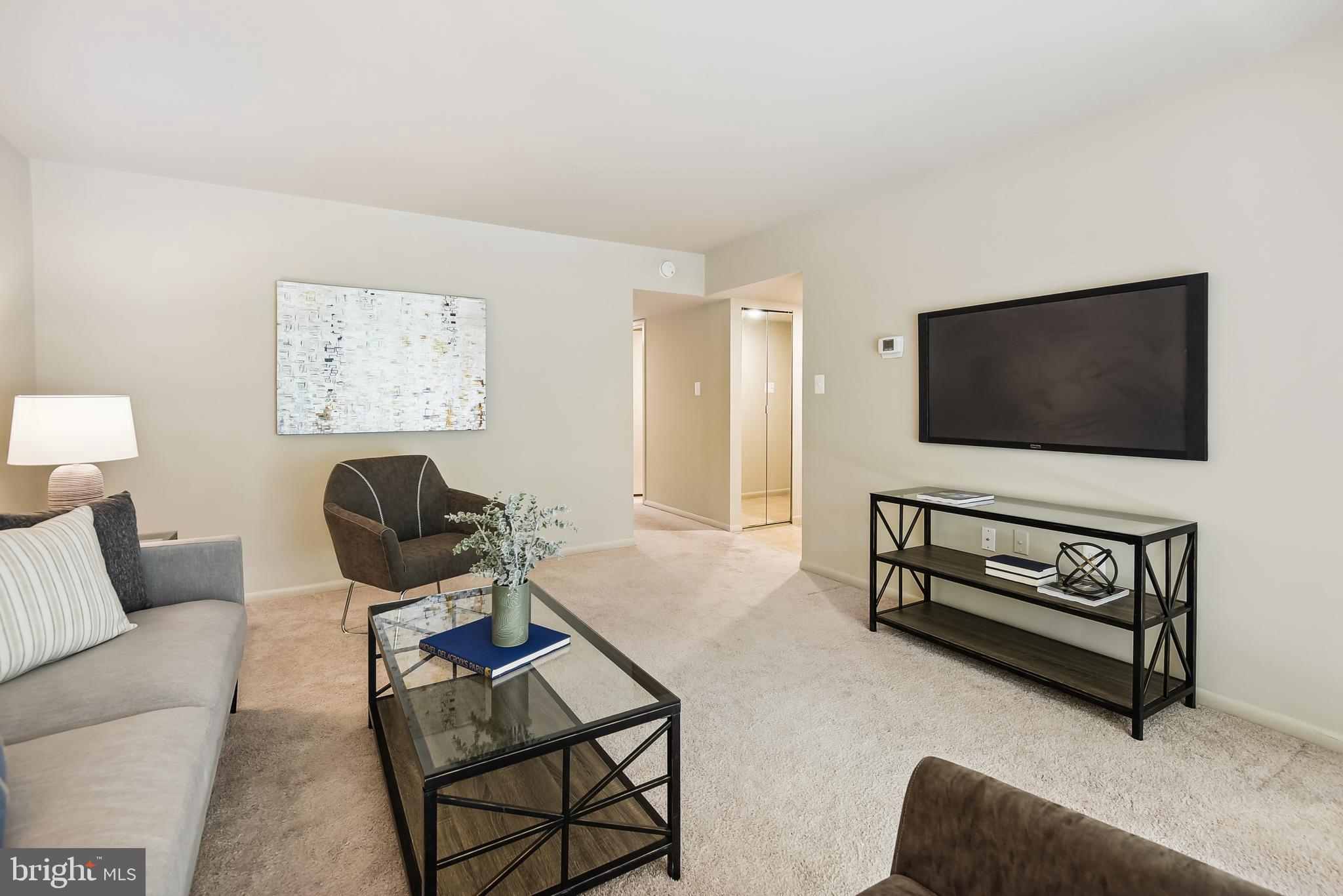 1416 Northgate Square, Unit 12B Reston, VA 20190 - Photo 5 of 23 Living Room opens to Hall and Entry