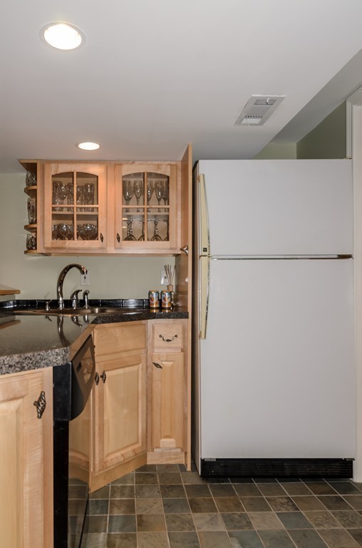 39 Rutgers Road Wellesley, MA 02481 - Photo 17 of 21 a kitchen with a refrigerator and a sink