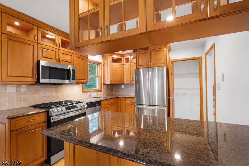 1 Baldwin Road Florham Park, NJ 07932 - Photo 12 of 33 a kitchen with stainless steel appliances granite countertop a refrigerator a stove and a microwave
