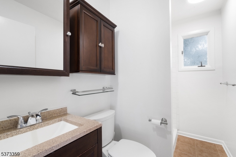1 Baldwin Road Florham Park, NJ 07932 - Photo 15 of 33 a bathroom with a sink toilet and vanity