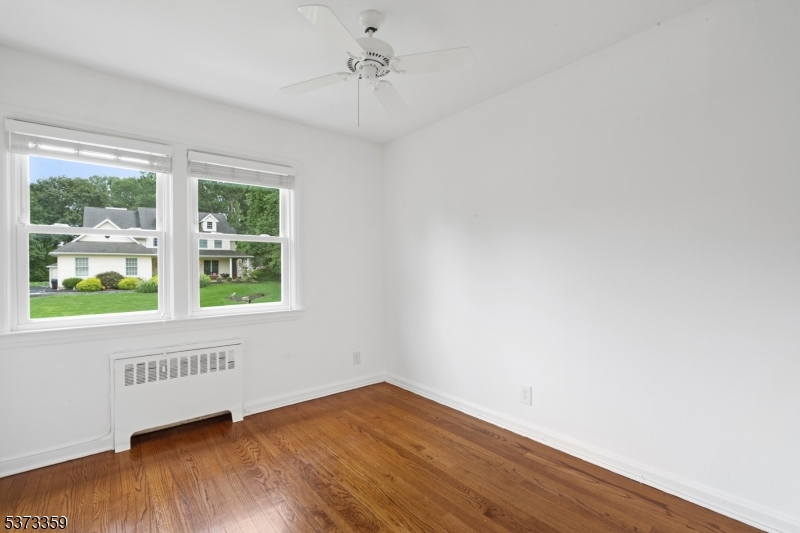 1 Baldwin Road Florham Park, NJ 07932 - Photo 20 of 33 wooden floor in an empty room with a window