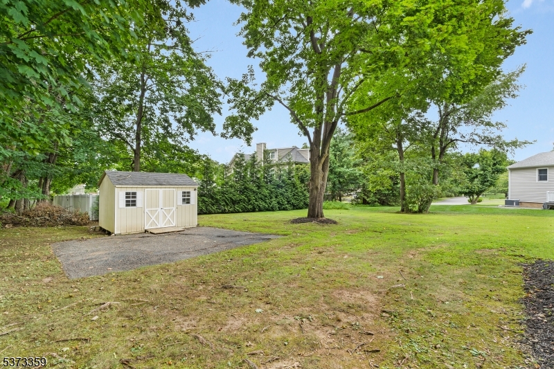 1 Baldwin Road Florham Park, NJ 07932 - Photo 28 of 33 a house with trees in front of it