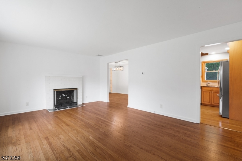 1 Baldwin Road Florham Park, NJ 07932 - Photo 4 of 33 a view of empty room with wooden floor