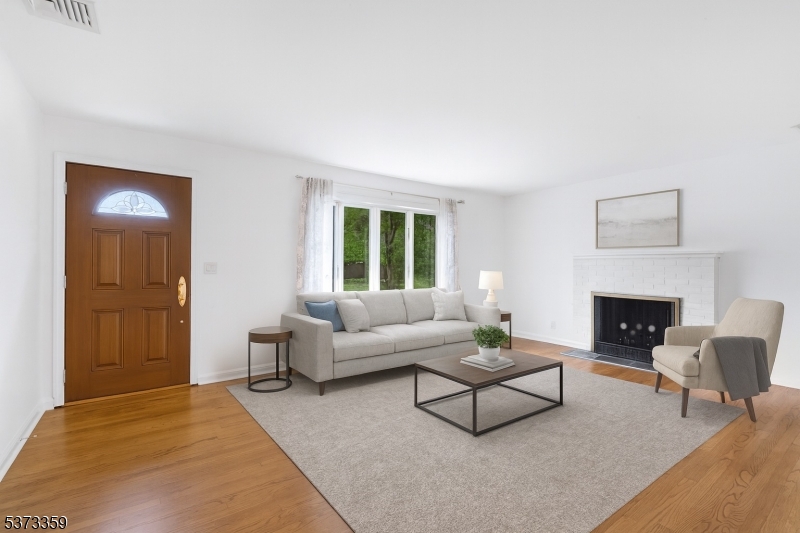 1 Baldwin Road Florham Park, NJ 07932 - Photo 5 of 33 a living room with furniture and a fireplace