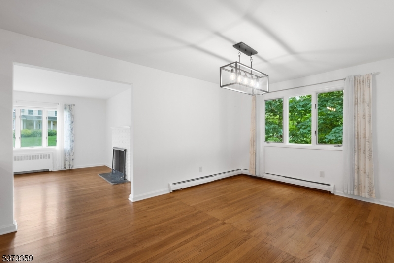 1 Baldwin Road Florham Park, NJ 07932 - Photo 10 of 33 an empty room with wooden floor chandelier and windows