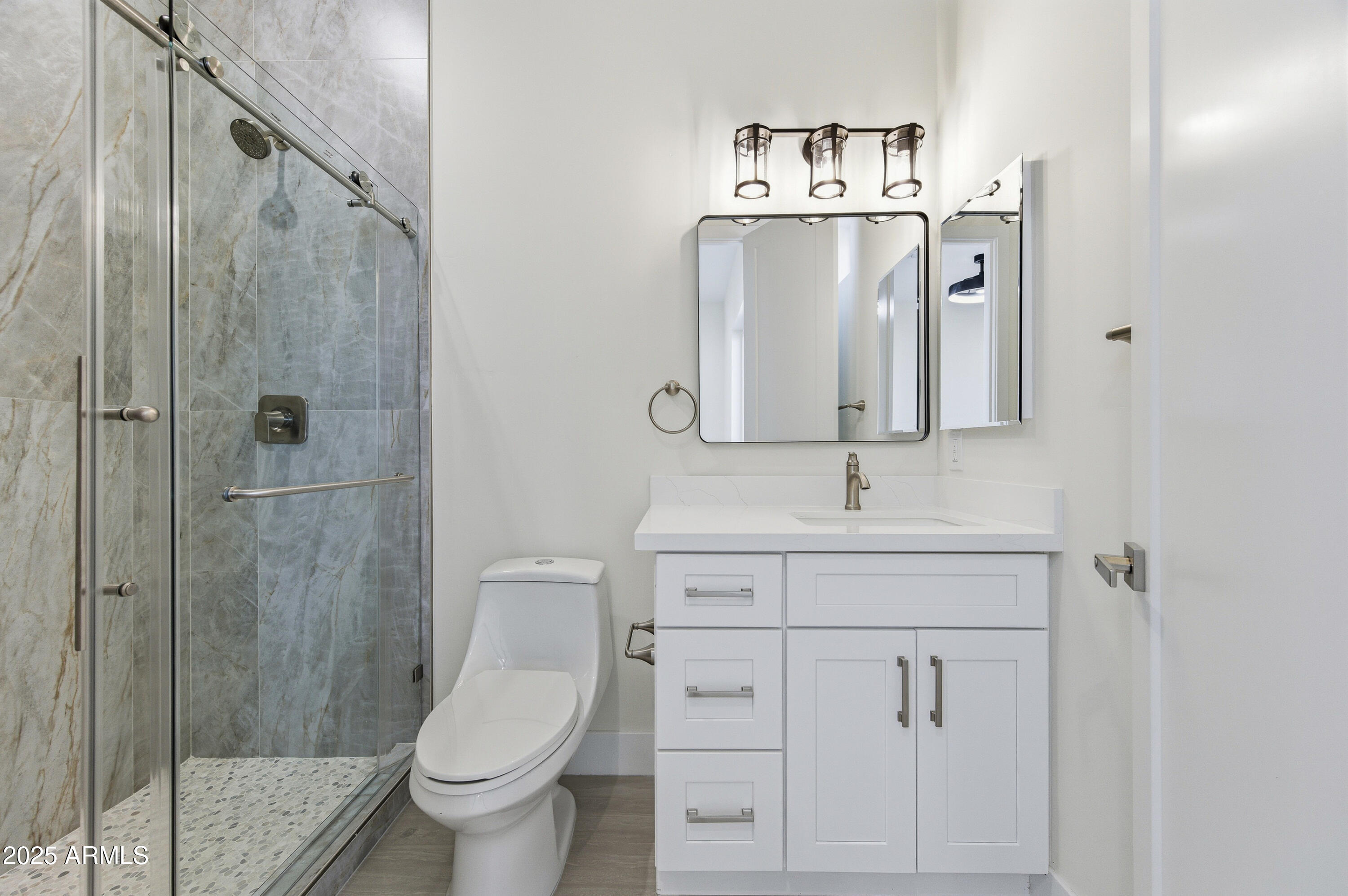 10039 North Burris Road Casa Grande, AZ 85122 - Photo 53 of 61 a bathroom with a toilet sink and shower