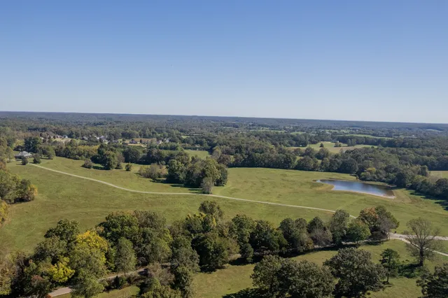 an aerial view of a houses with outdoor space