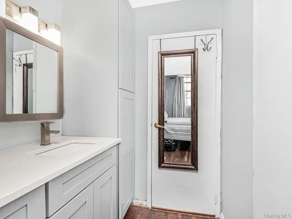a bathroom with a sink and a mirror