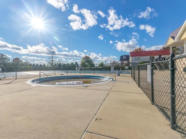 a view of a swimming pool with a patio
