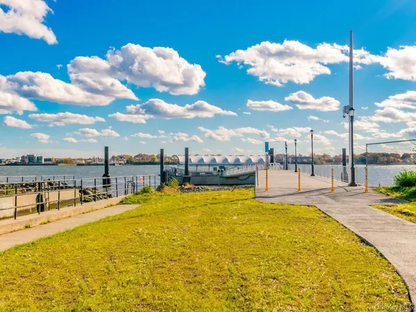 a view of a swimming pool with a table and chairs
