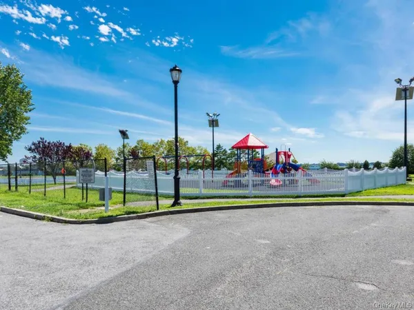 a view of a park with a slide and table