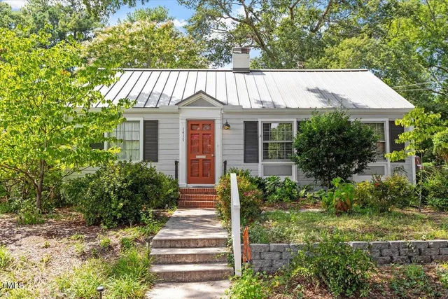 a view of front of house with a yard