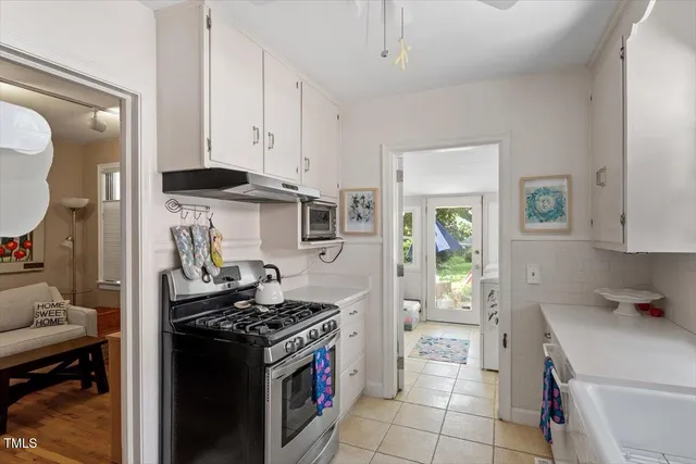 a kitchen with a stove and a refrigerator