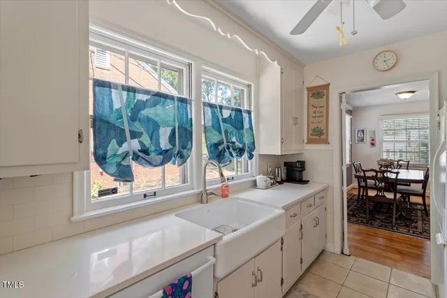 a kitchen with a stove a sink and a refrigerator