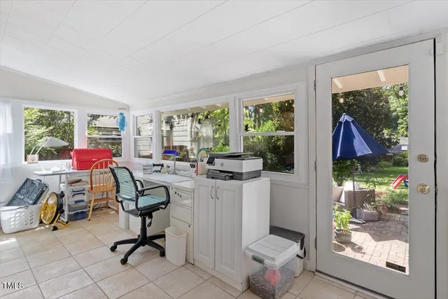 a workspace with furniture and a window