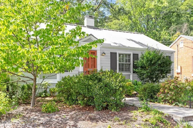 a house with a tree in front of it
