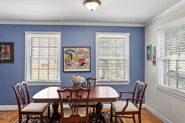 a view of a dining room with furniture and window