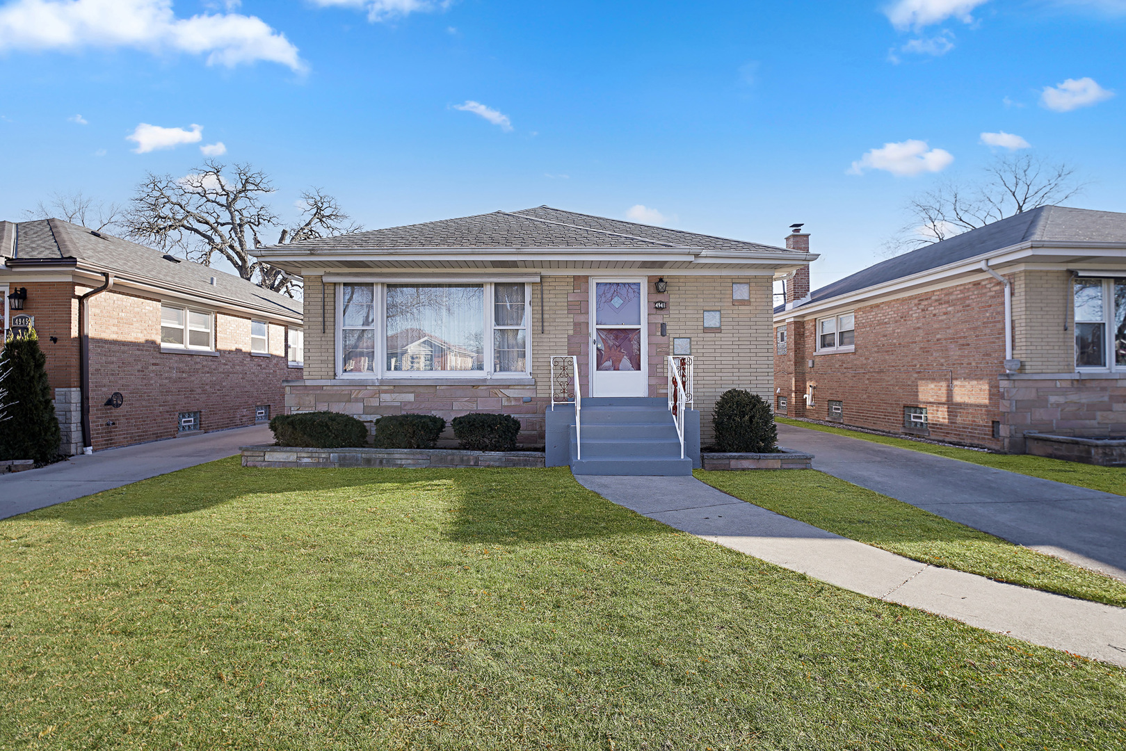 4941 North Normandy Avenue Chicago, IL 60656 - Photo 2 of 35 a view of a house with a swimming pool and a yard