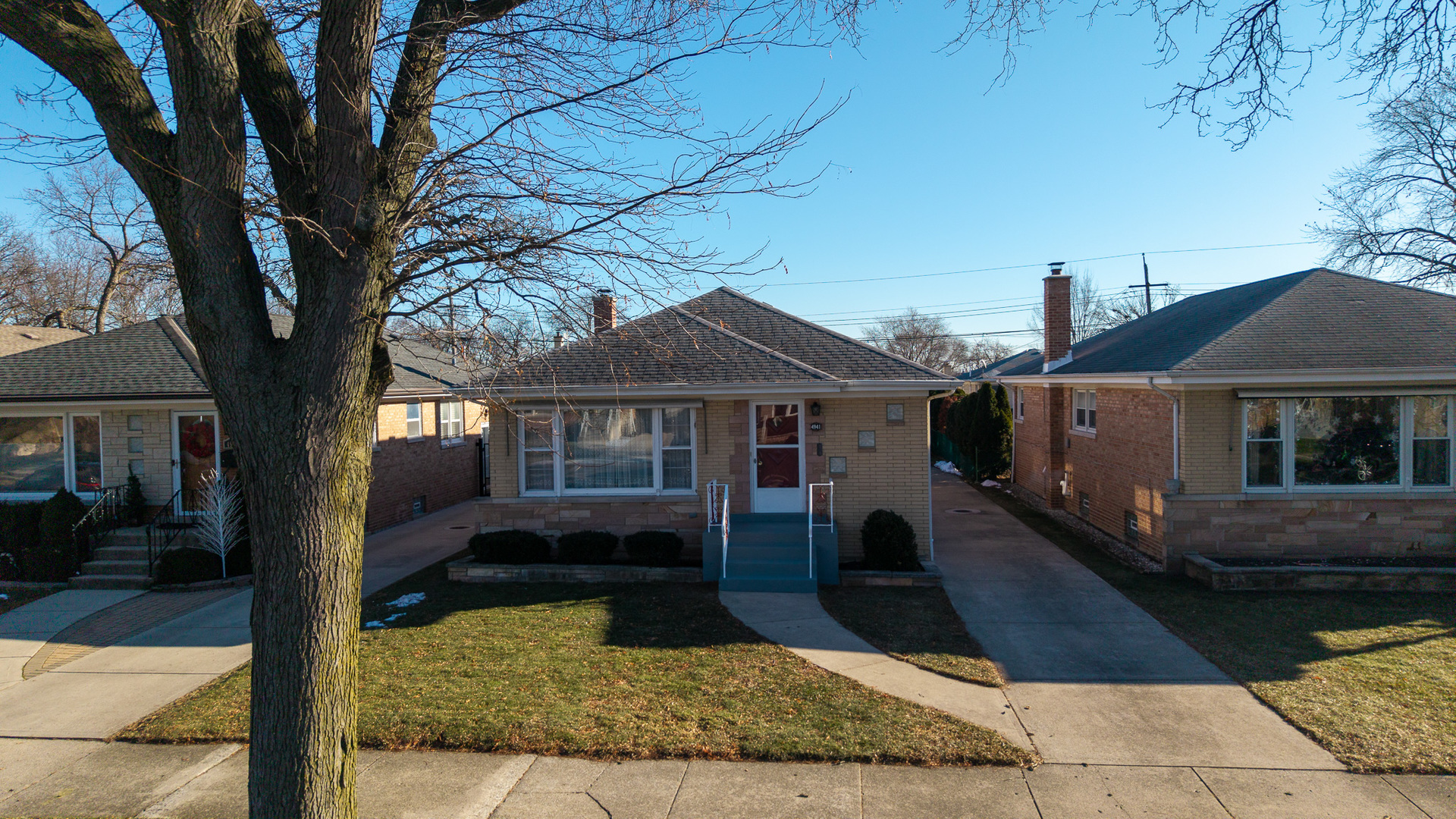 4941 North Normandy Avenue Chicago, IL 60656 - Photo 27 of 35 a front view of a house with yard garage and outdoor seating