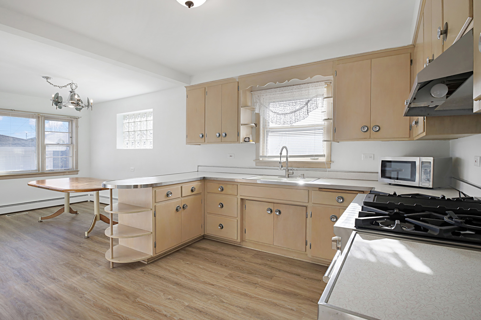 4941 North Normandy Avenue Chicago, IL 60656 - Photo 6 of 35 a kitchen with a sink stove and window