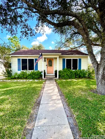a front view of house with yard and green space