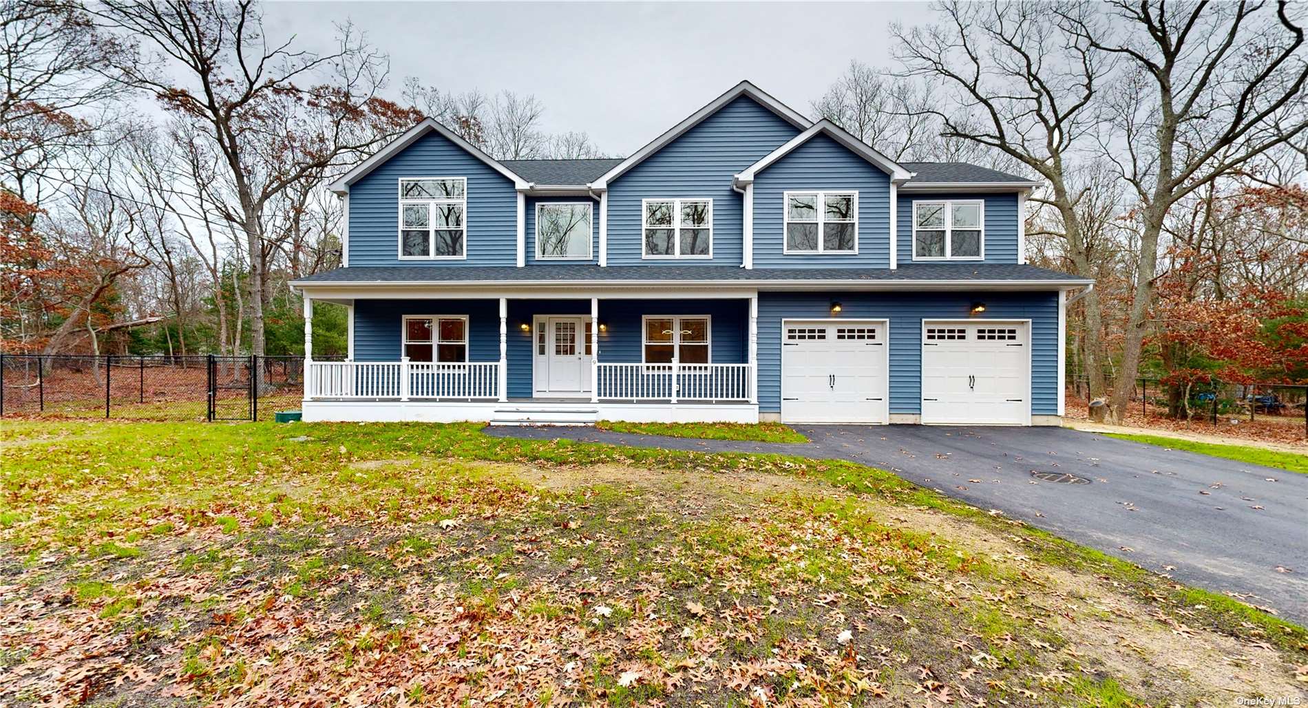 9 Smith Road Ridge, NY 11961 - Photo 1 of 1 a front view of a house with a garden