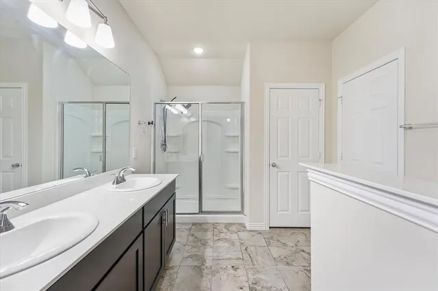 a bathroom with a double vanity sink mirror and double