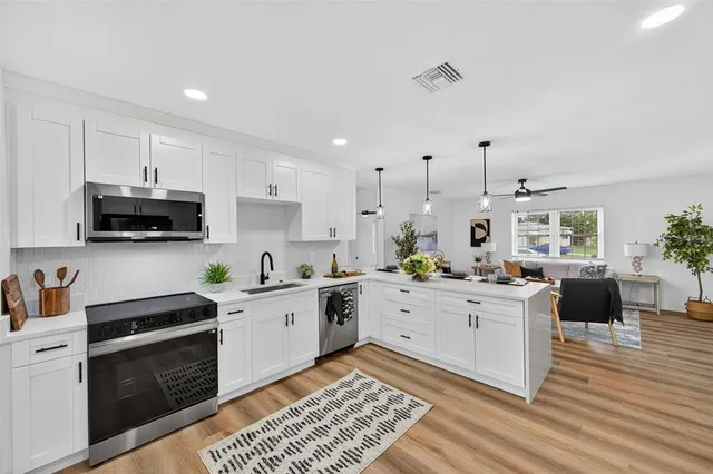 a bed room with a bed mirror and a window