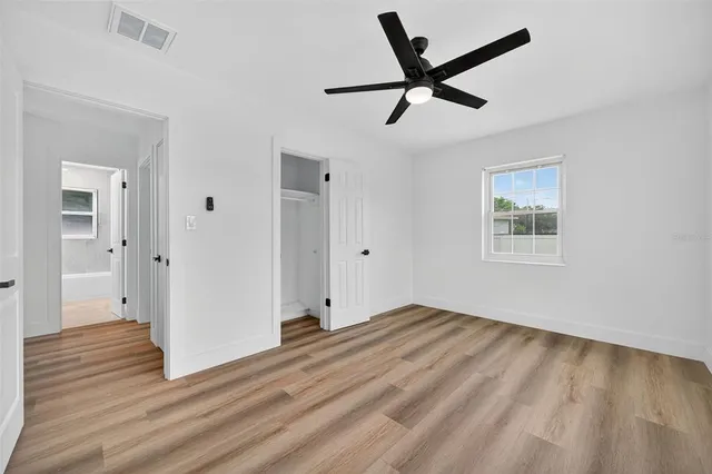 a room with furniture and wooden floor