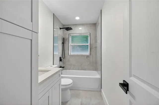 a view of backyard with house and garden