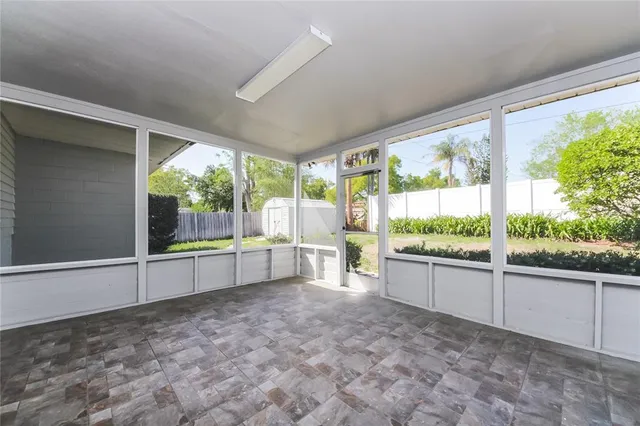 a large white outdoor space with a large window