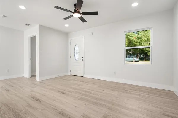 a view of an empty room with a window
