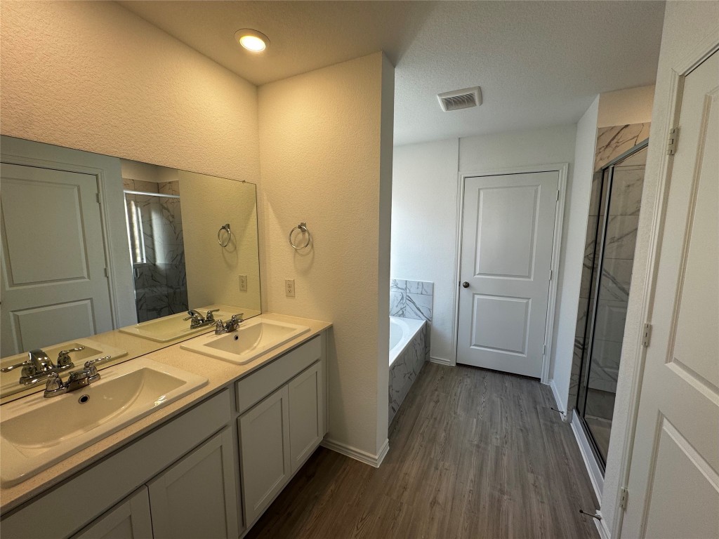 515 Avre Loop Kyle, TX 78640 - Photo 4 of 4 a bathroom with a sink and mirror