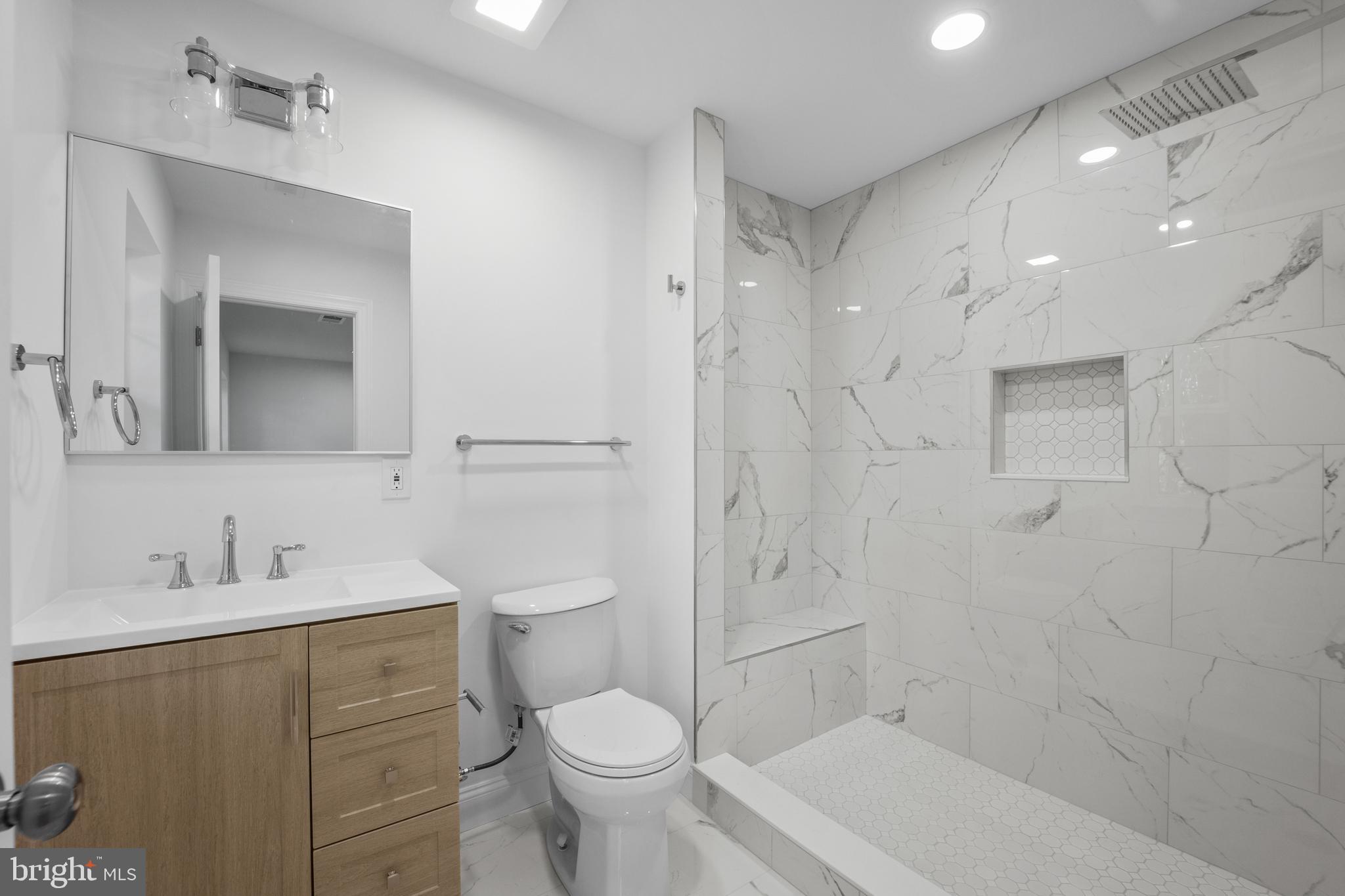 492 Ellis Avenue Lawnside, NJ 08045 - Photo 29 of 33 a bathroom with a sink toilet a mirror and shower