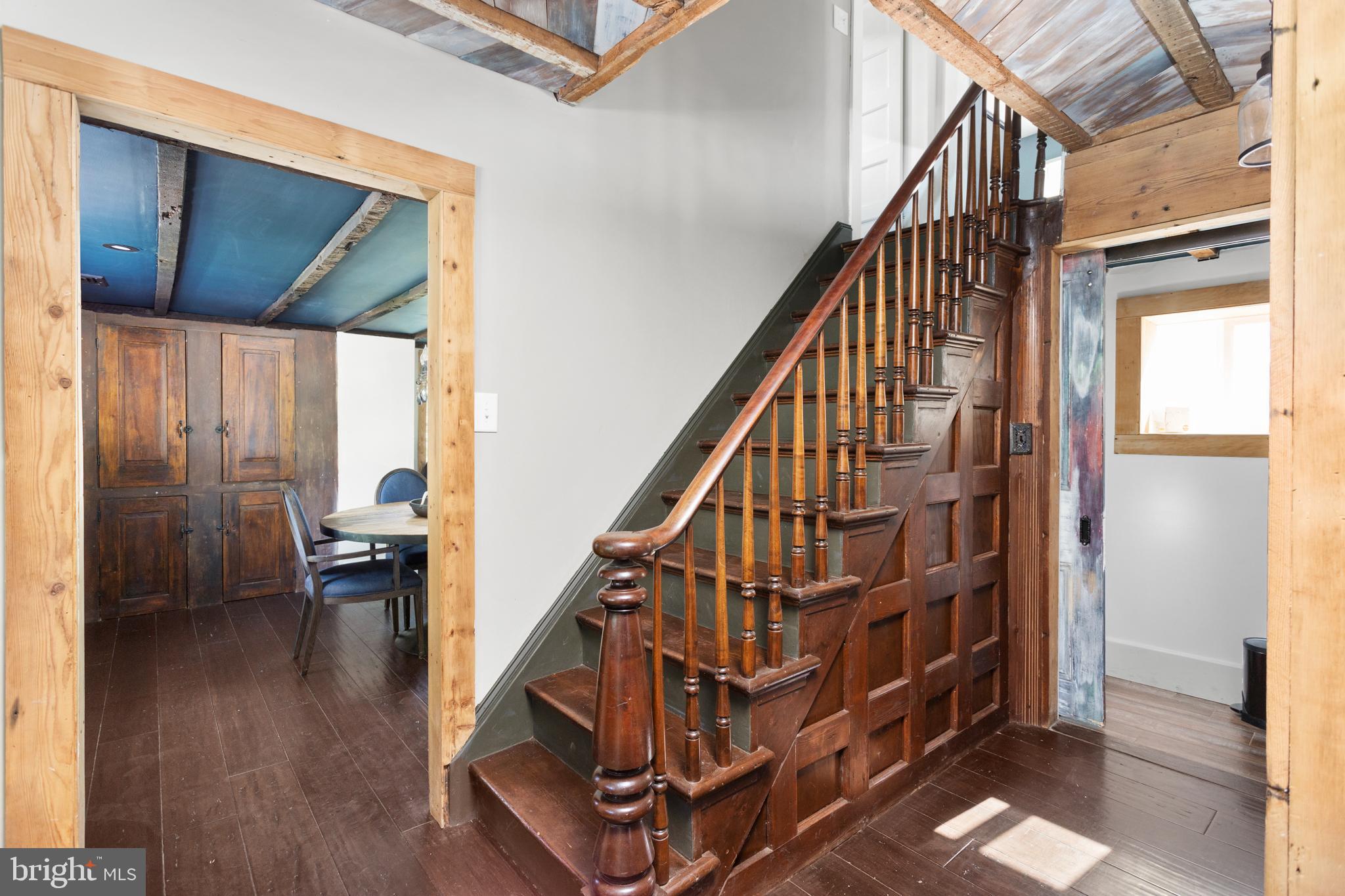 942 Province Line Road Allentown, NJ 08501 - Photo 14 of 50 a view of staircase with lots of frames on wall and a dining table