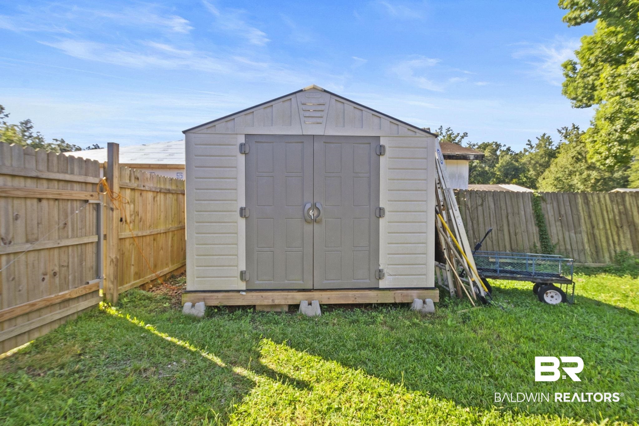 707 North Cedar Street Foley, AL 36535 - Photo 47 of 69 View of outbuilding featuring a lawn