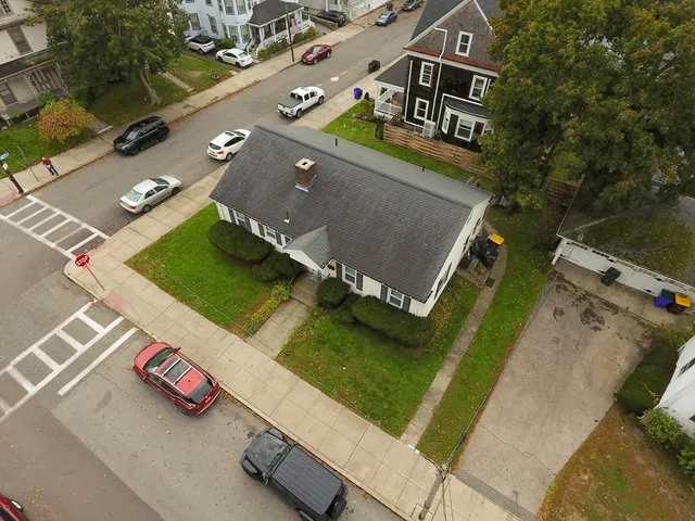 an aerial view of a house with a garden