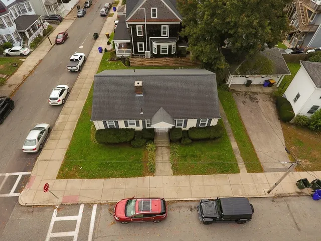 an aerial view of a house with swimming pool