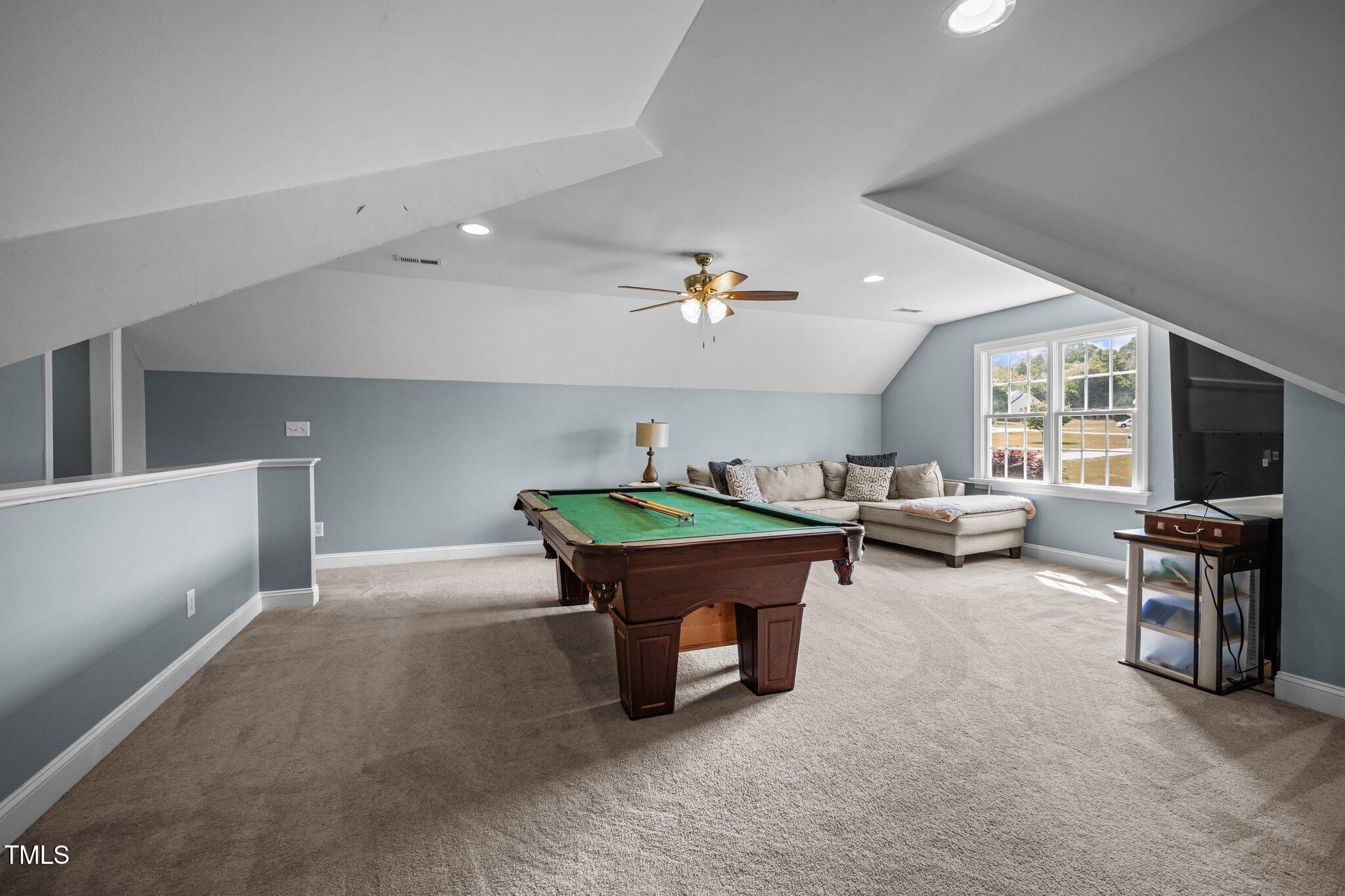 281 Derwin Drive Timberlake, NC 27583 - Photo 25 of 29 a room with furniture and a flat screen tv