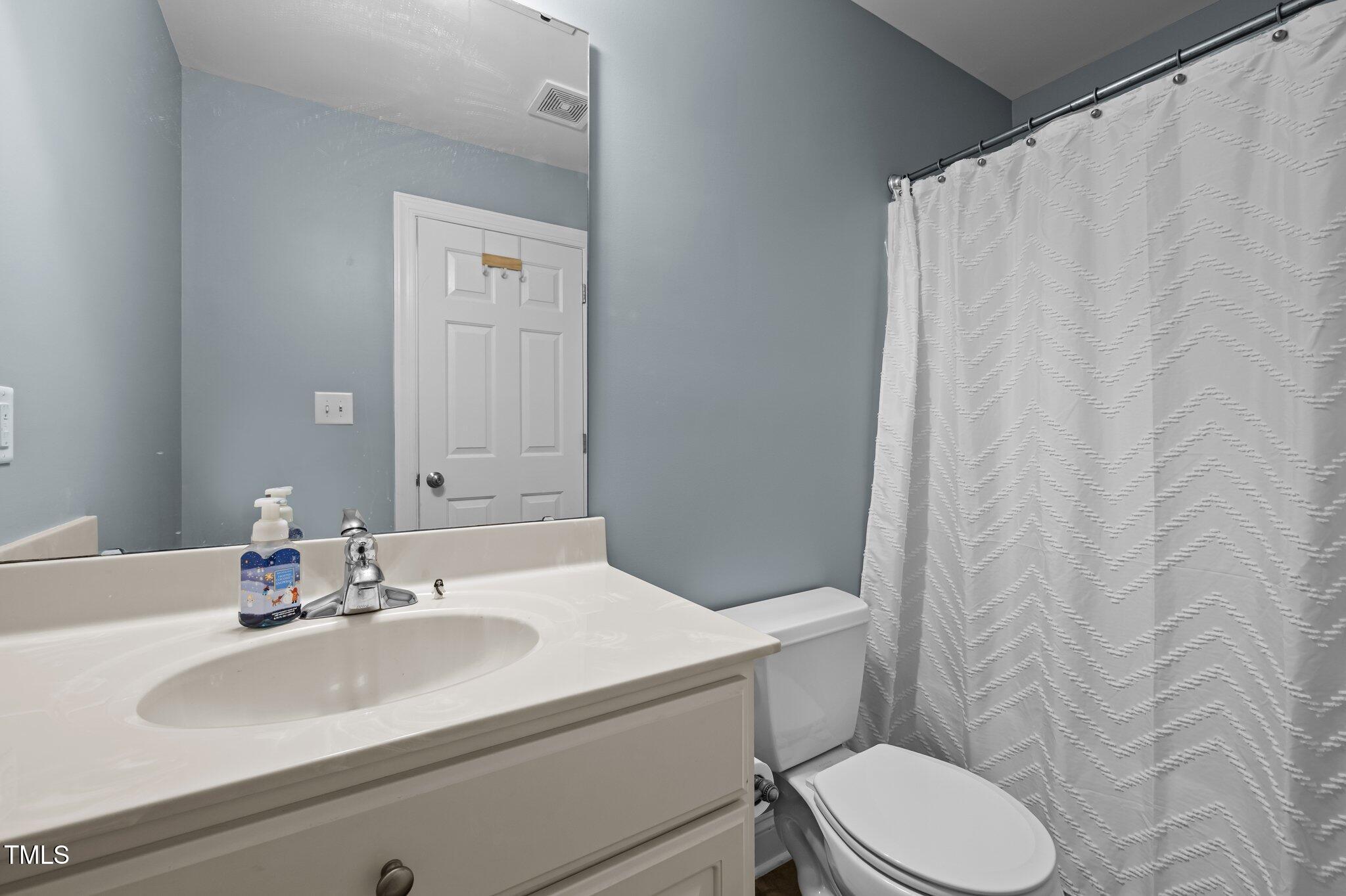 281 Derwin Drive Timberlake, NC 27583 - Photo 26 of 29 a bathroom with a sink and a toilet