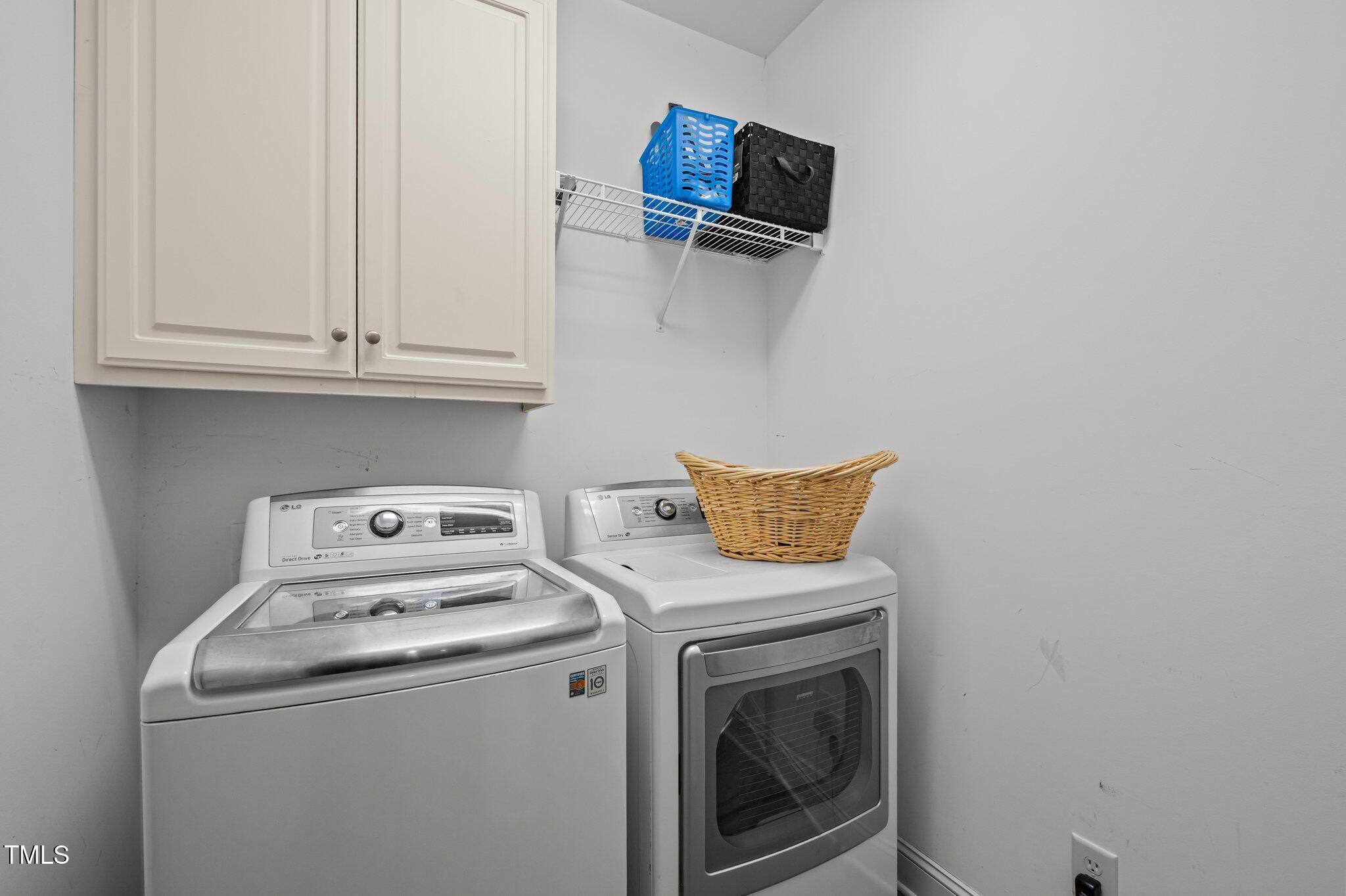 281 Derwin Drive Timberlake, NC 27583 - Photo 27 of 29 a utility room with dryer and washer