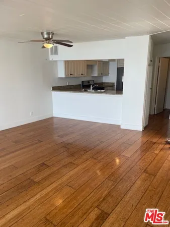 a view of a kitchen from the hallway