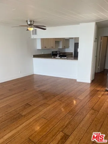 a view of a kitchen from the hallway