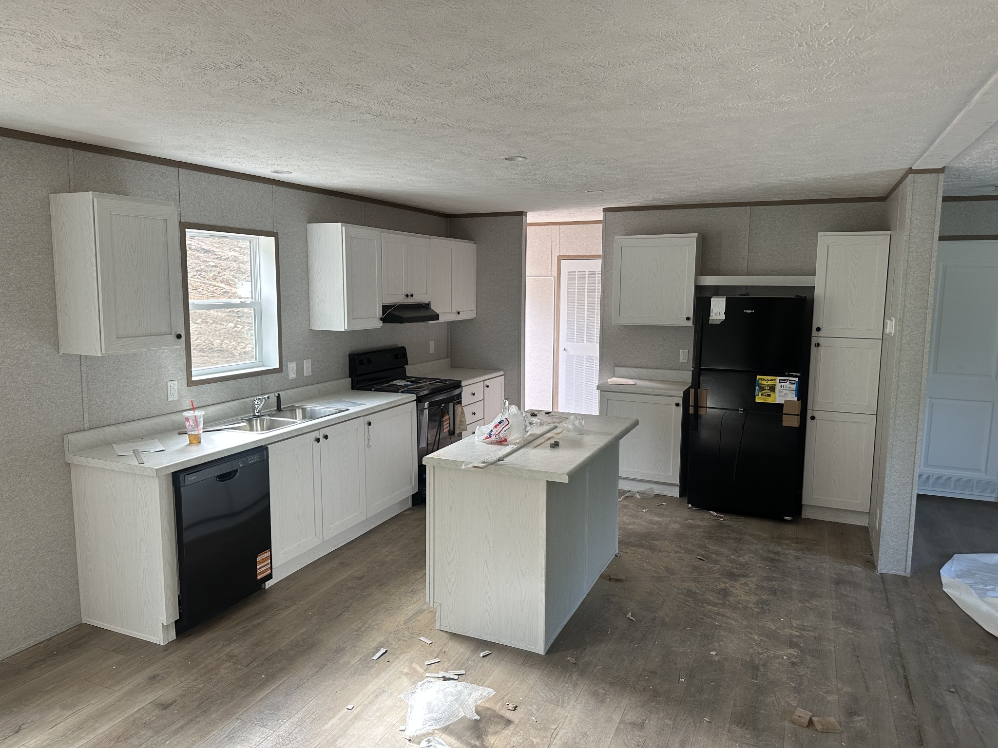 406 Shiloh Church Road Woodbury, TN 37190 - Photo 12 of 18 a kitchen with a sink and refrigerator