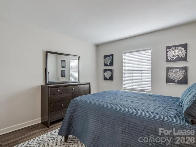 a bathroom with a granite countertop toilet a sink and bathtub