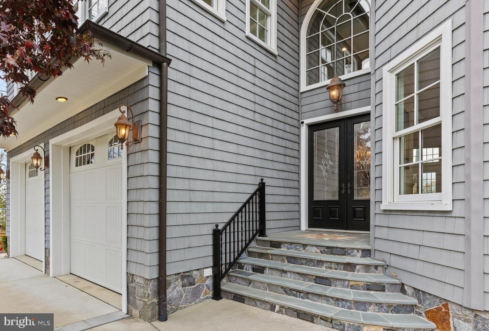Stone entry and palladian window