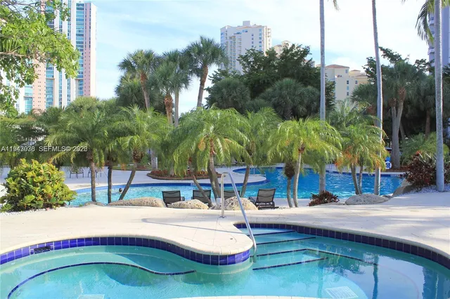 a swimming pool with outdoor seating and yard