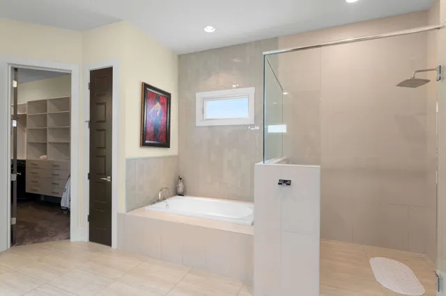 a bathroom with a toilet sink and shower