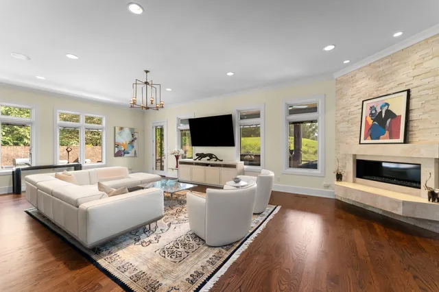 a living room with furniture fireplace and flat screen tv