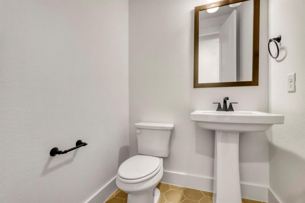 4312 Double Diamond Prosper, TX 75078 - Photo 12 of 29 a bathroom with a sink and a toilet